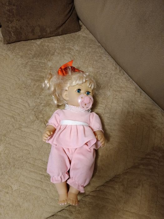 Куклы говорящая в розовой одежде