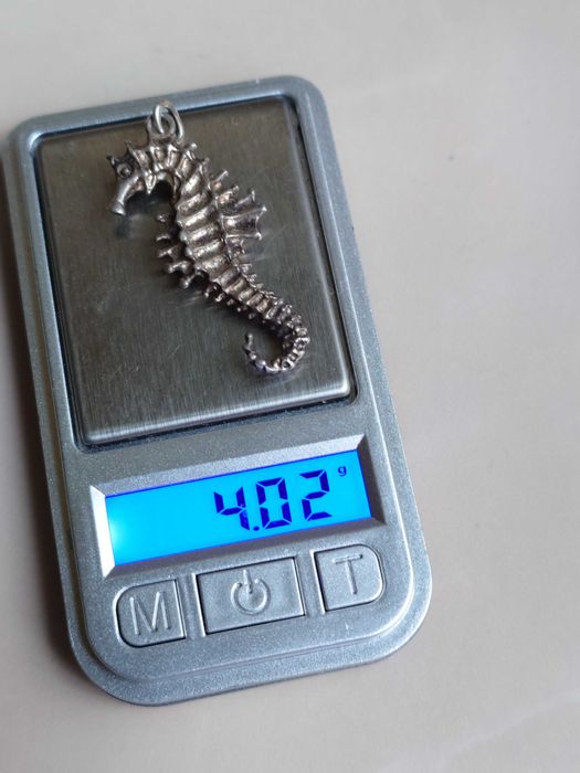 Pandantiv din argint cu reprezentarea unui Calut de mare