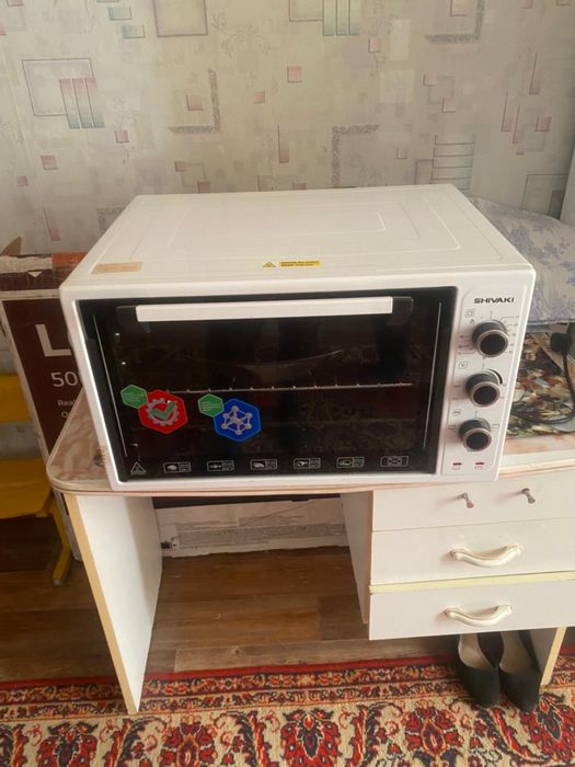 Продам настольную духовку новую