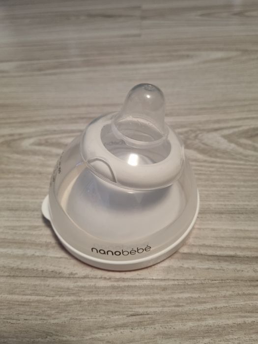 Бебешка бутилка със затопляща купа