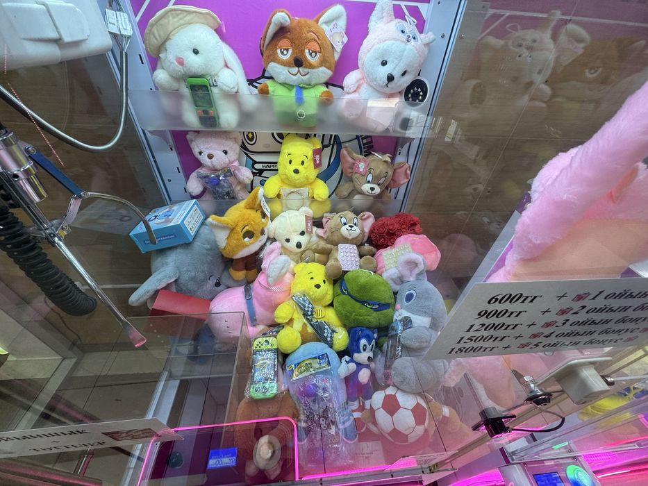 Игрушка аппарат хватайка
