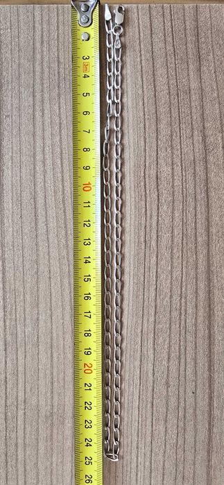 Сребърен ланец със сребърна висулка рог.