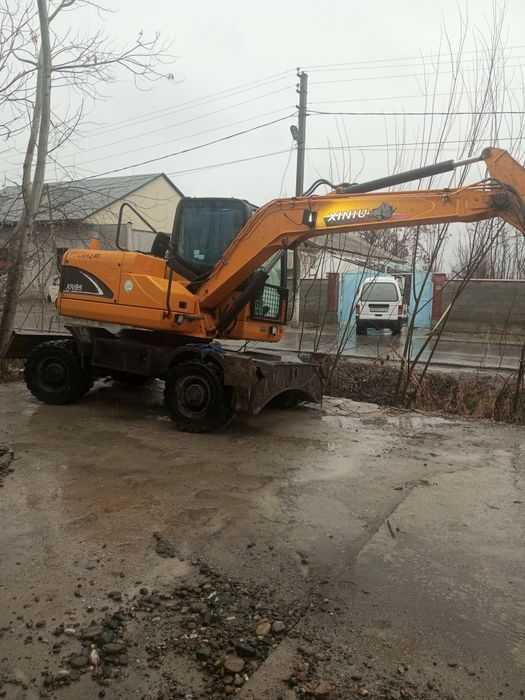 Экскаватор хизмати