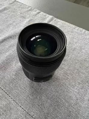 Obiectiv Sigma 35mm F1.4 DG + filtru hoya montura Nikon