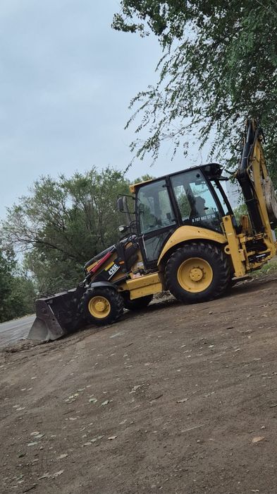 Услуги экскаватора 3 в 1 CAT
