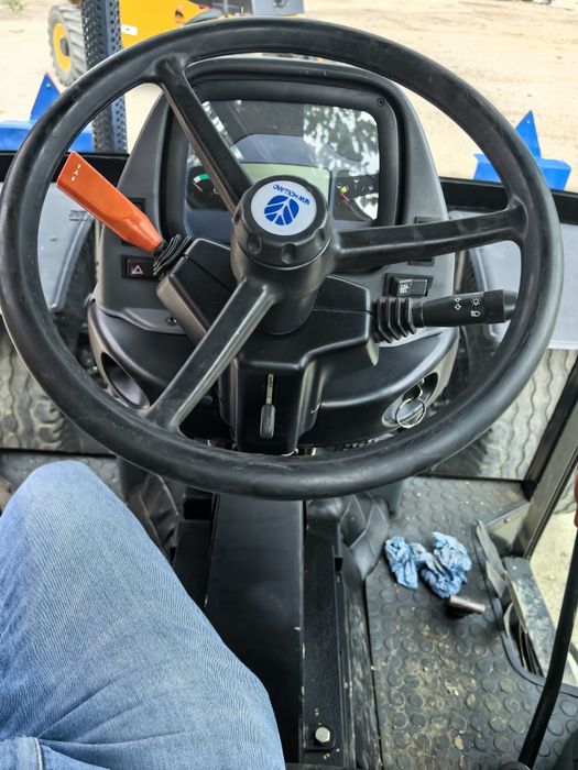 Tractor New Holland volan reversibil, freza forestiera tocător