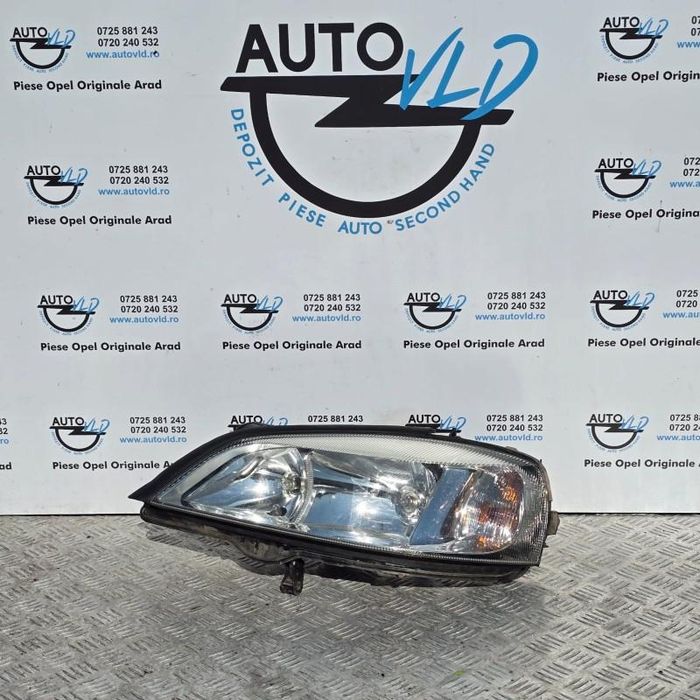 Far stanga fundal crom Opel Astra G
