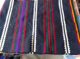 Вълнено платно за покриване на легло, за стена или за пода.