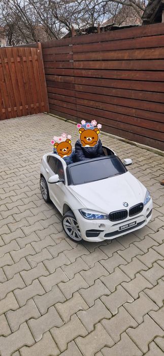 Mașinuța electrica BMW X6M 2 locuri
- centură de