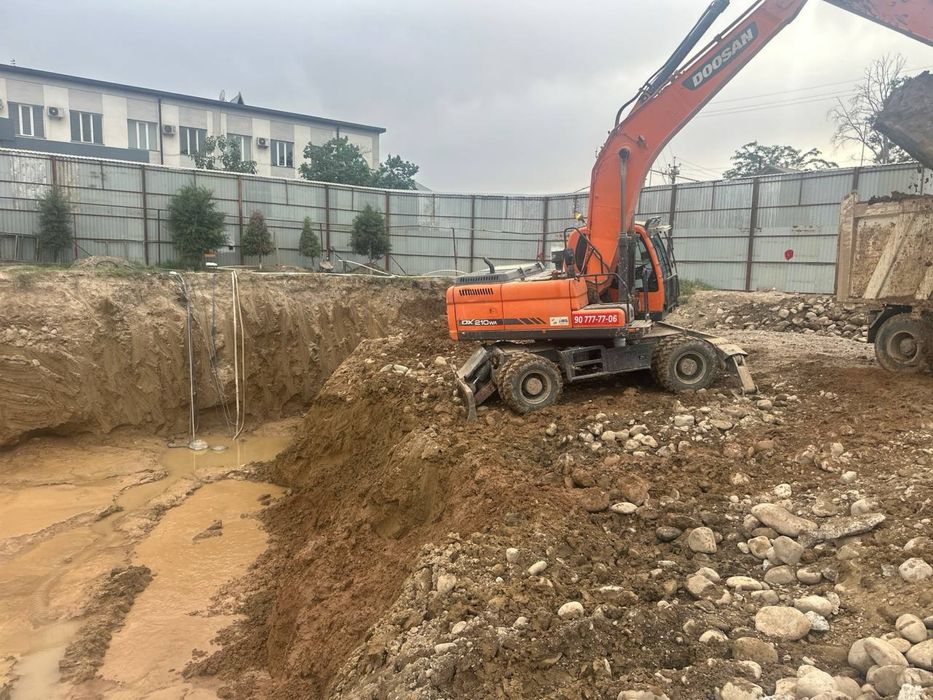 Экскаватор хизмати