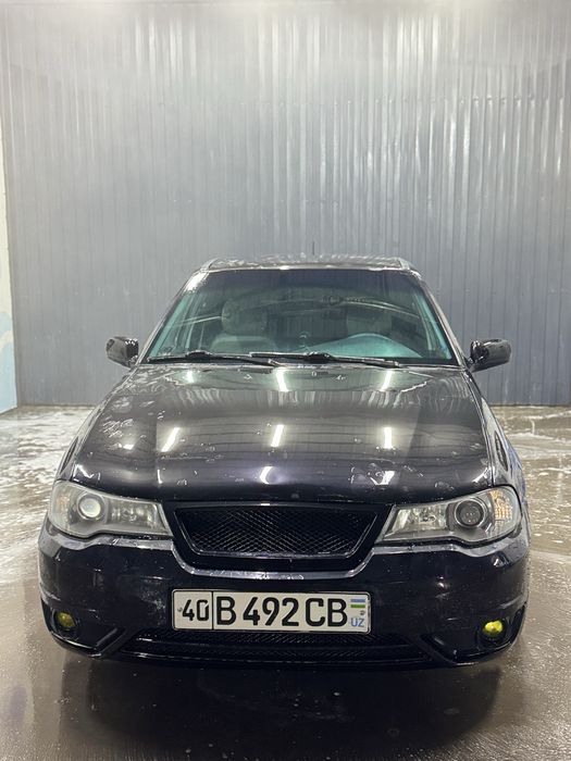 Nexia 2 1.6 mator rangi qora 2009 yil..