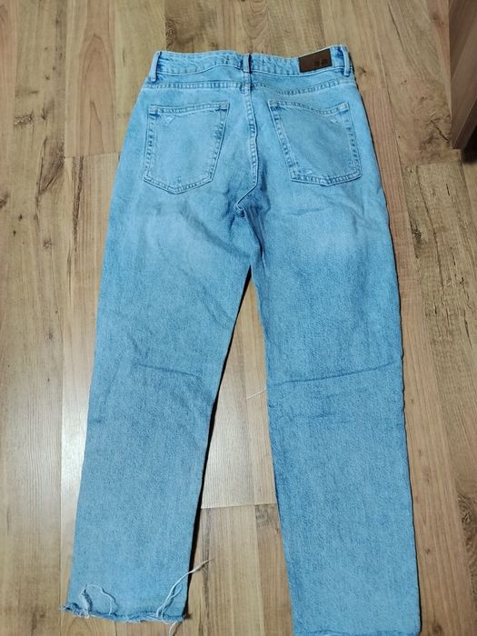 Blugi wide leg decupați in genunchi Zara