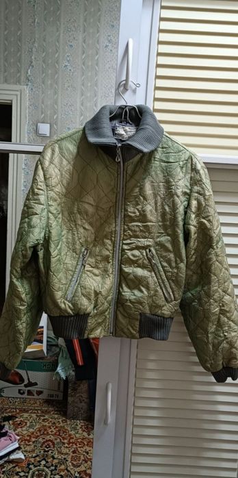 Куртки и пуховики длинные и короткие