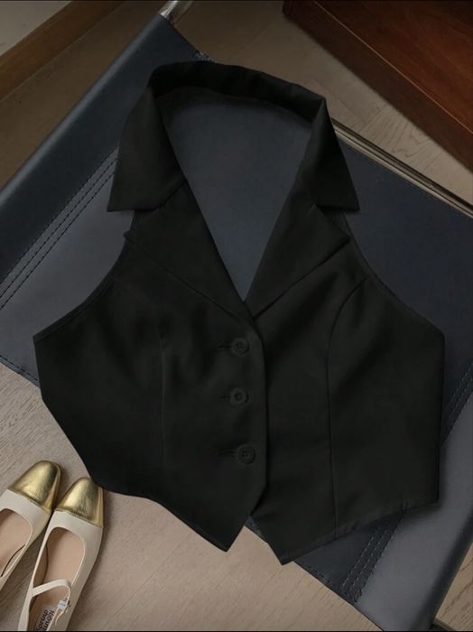 Черен елек с ластинк на гърба