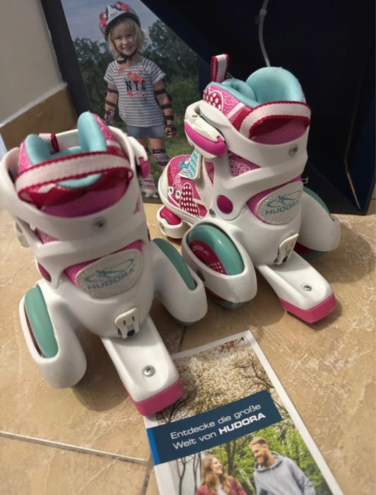 Patine cu rotile mărimi reglabile 26-29 - Roz, stare foarte buna.