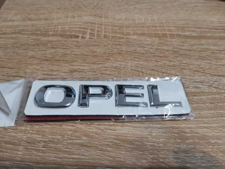 сребрист надпис Opel