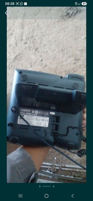 Телефон Linksys.