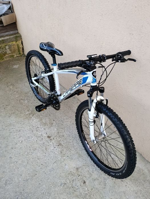 Vând bicicletă copii cu roți pe 24.