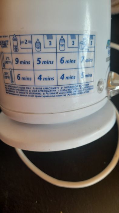 Уред за топлене на бебешко мляко