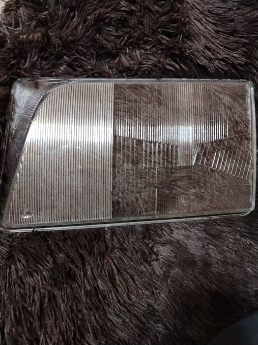 W124  стекло фара Оргенал HELLA