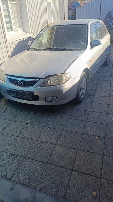 Мазда 323 по запчастям 2002год выпуска.