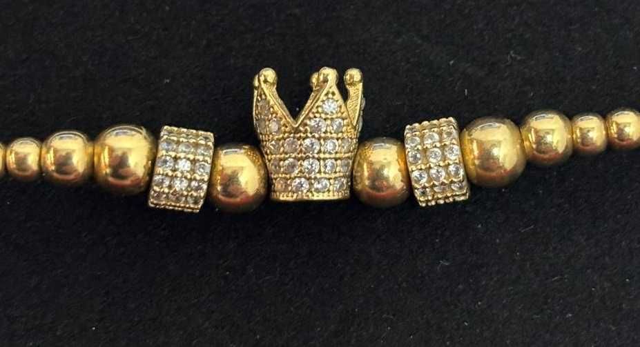 Bratara snur cu bile si coroana din aur galben de 14k
