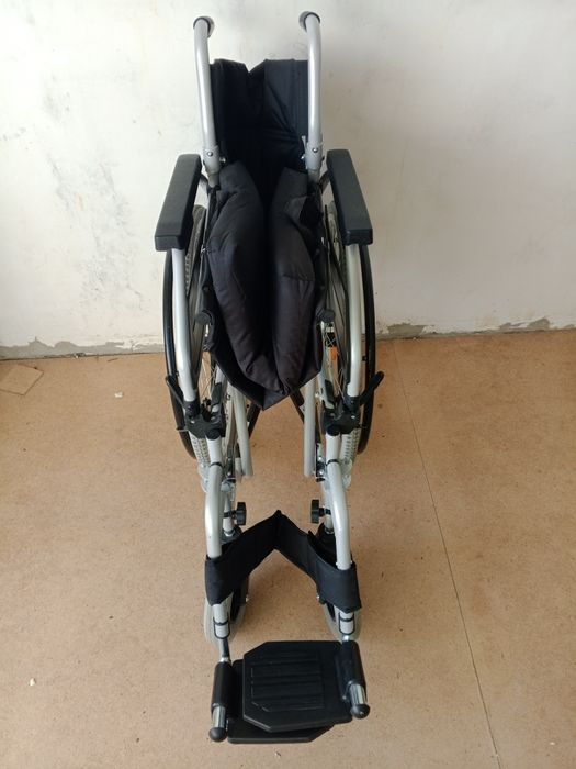 Инвалидная кресло.