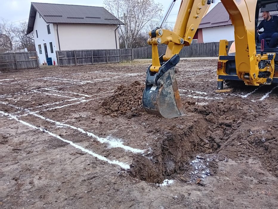 Buldoexcavator caterpillar