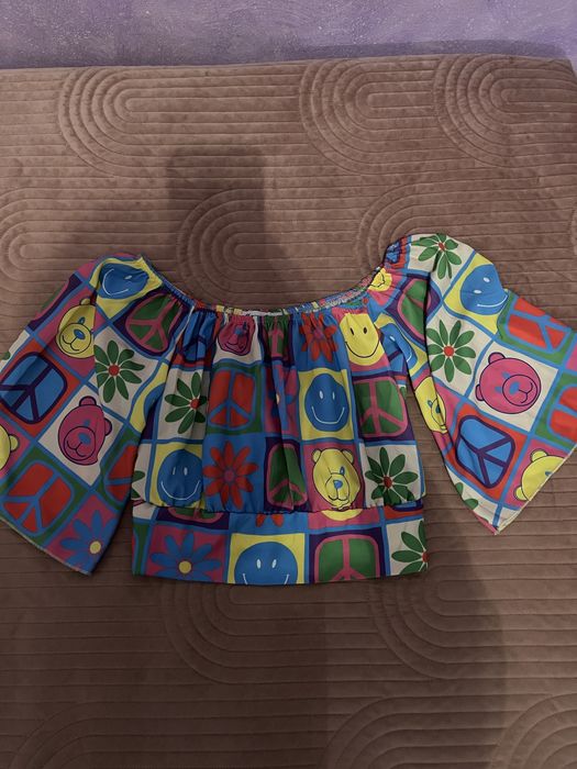 Compleu top si pantaloni cu taietura pe picior