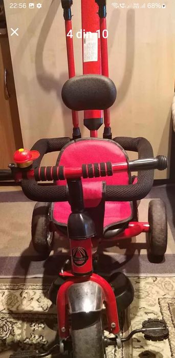 Vând bicicleta cu pedale,  copertină și mâner de ghidare