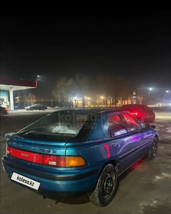 Машина мазда 323