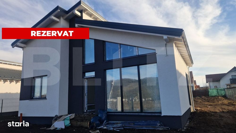 Casa Harman individuala , 712 mp teren , moderna, intabulata toate uti