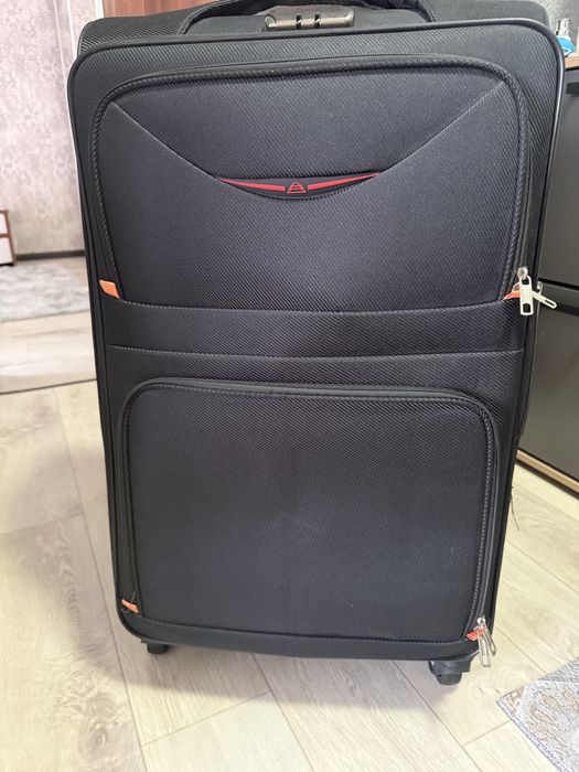 Продам новый чемодан размер L черный