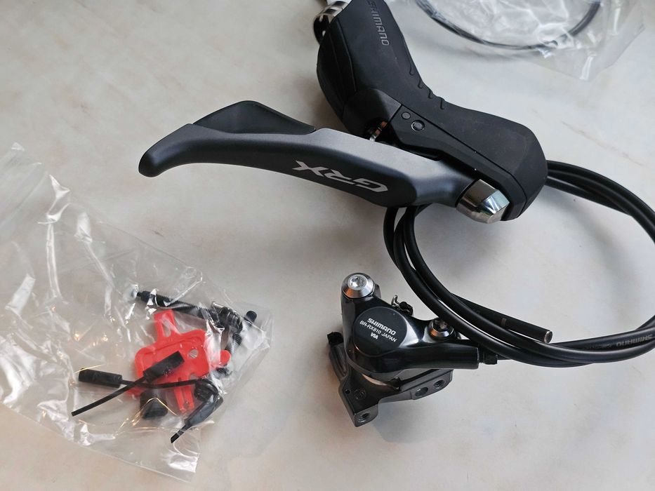 Set frane manete Shimano GRX ST-RX810 + BR-RX810 2x11 fata + spate noi