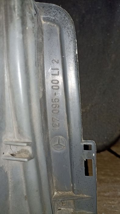 Фара левая Mercedes 190e Hella