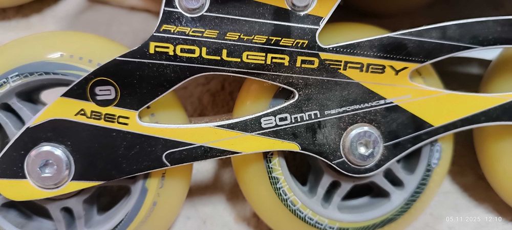 Роликовые коньки