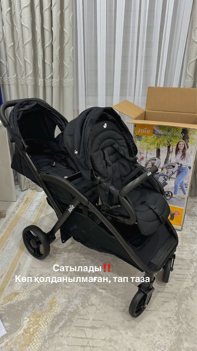 Коляска для погодок