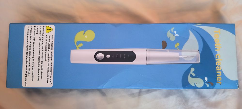 Уред за ултразвуково почистване на зъби