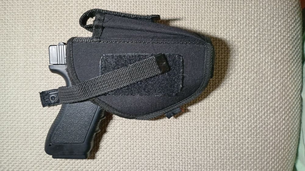 Toc arma cu prindere pe centrura.