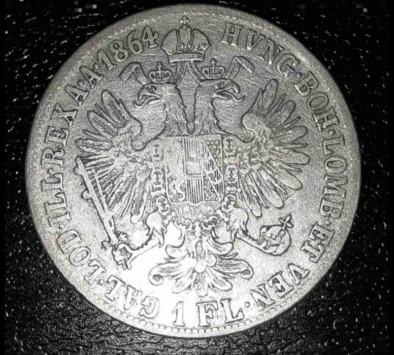 Monedă argint 1 forint 1864-B  Franc Joshep I, Kremnica 
---

*Titlu:*  
Monedă argint 1 Forint 1864 B - Franz Joseph I, Kremnica

*Descriere:*  
Vând