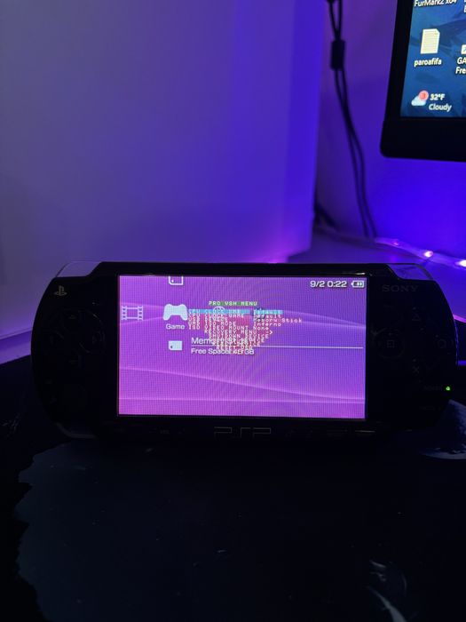 PSP 2003 Modat, Impecabil, cu multe jocuri si card de 64 Gb