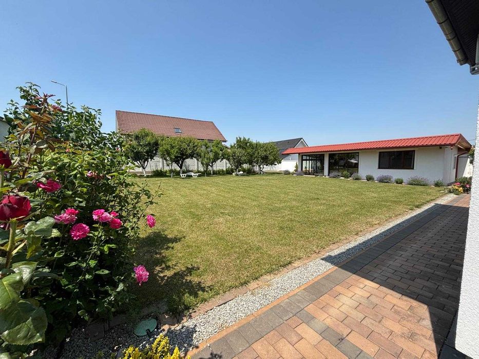Vând casă P+M  în Sânmartin + un teren de 542 m2