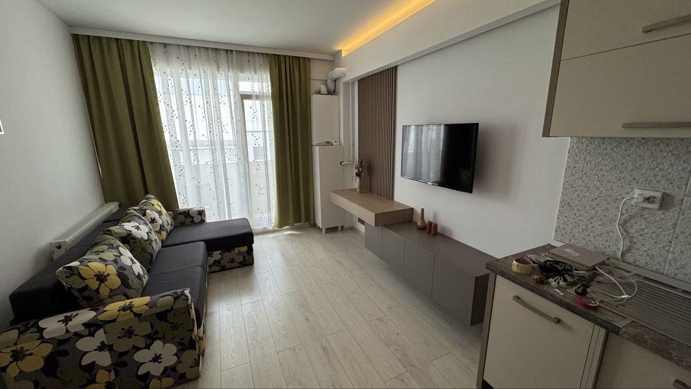 Inchiriez apartament 2 camere zona centrala str traian mobilat modern cu parcare subterana inclusa etaj3 bloc nou