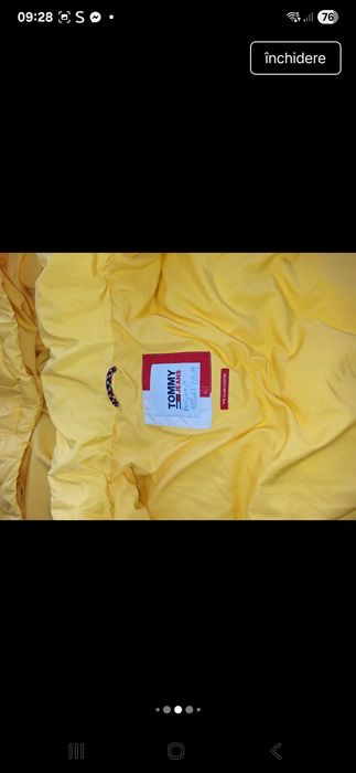 Geaca puffer Tommy  are defeect la maneci se vede in poza