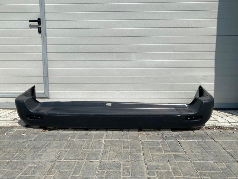 Бампер задний на ленд крузер 100