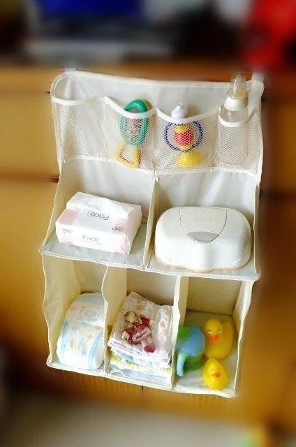 Raft din pânză ce poate fi prins de pătuțul bebelușului