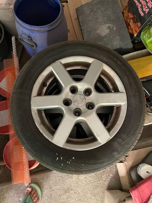 Гуми  15ки с лети джанти за нисан  almera 185/65/15 nexen