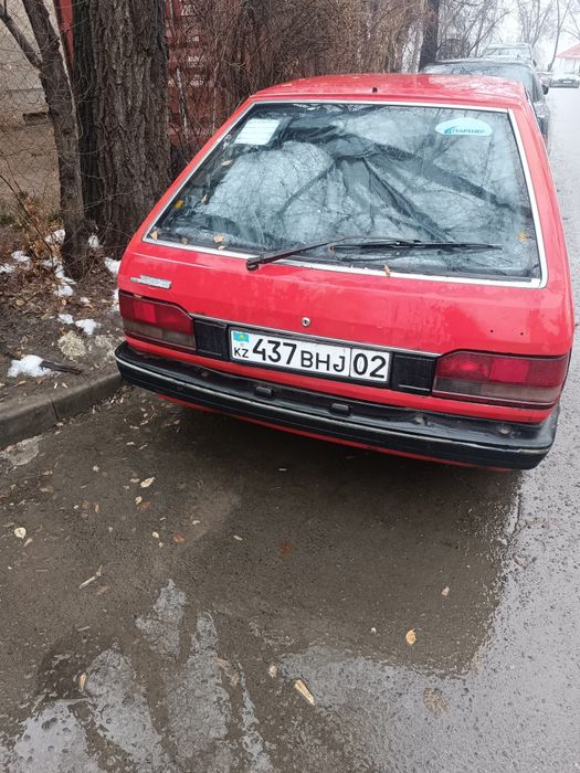 Задний бампер Mazda 323 bf