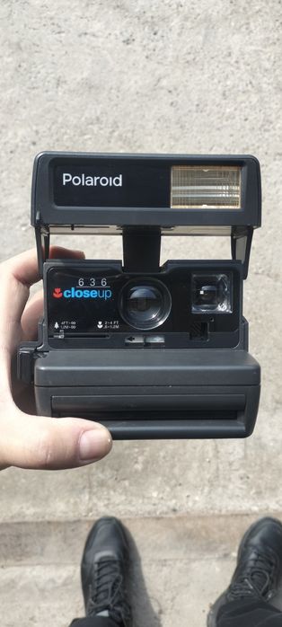 Полороид фотоаппарат.