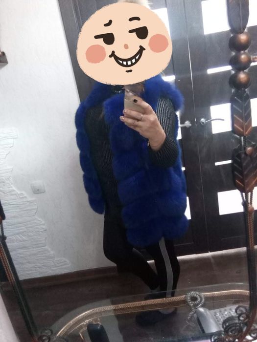 Продам новую женскую меховую жилетку